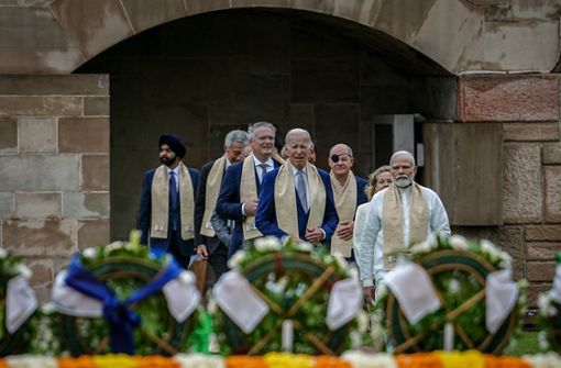 Die Staats- und Regierungschefs besuchen gemeinsam die Mahatma-Ghandi-Gedenkstätte. Foto: dpa/Kay Nietfeld