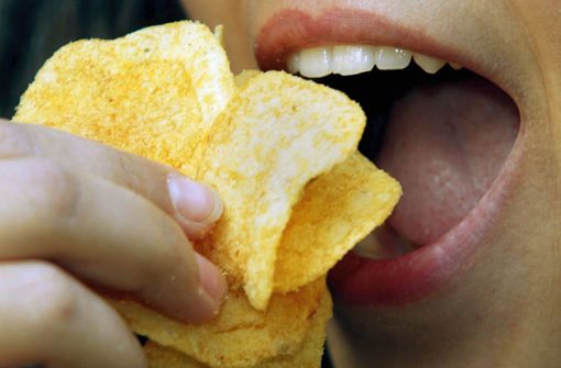 Was steckt hinter plötzlichem Heißhunger auf Chips und Co.? Foto: dpa/dpaweb