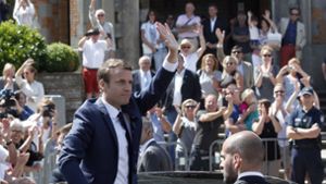 Der französische Staatspräsident Emmanuel Macron hat allen Grund zur Freude. Foto: AP