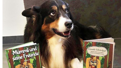 Familienhund Murph ist offensichtlich   Fan des Kinderbuchs seiner Besitzerin. Foto:  
