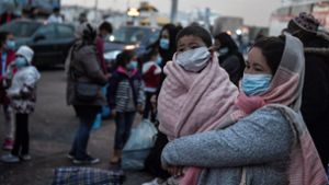 Flüchtlinge aus dem Lager Moria in Griechenland. Foto: AFP/LOUISA GOULIAMAKI