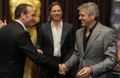 Treffen der Giganten (von links): Jean Dujardin (The Artist), Brad Pitt (Moneyball) und George Clooney (The Descendants) sind in der Kategorie Bester Hauptdarsteller nominiert. Foto: AP