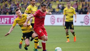 Emiliano Insua setzt sich gegen Marco Reus gut durch. Am Ende reichte es für den VfB in Dortmund allerdings nicht zu einem Erfolg. Foto: Pressefoto Baumann