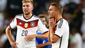 Kramer (li.), Podolski: Enttäuschung nach dem 1:2 gegen die USA Foto: Getty