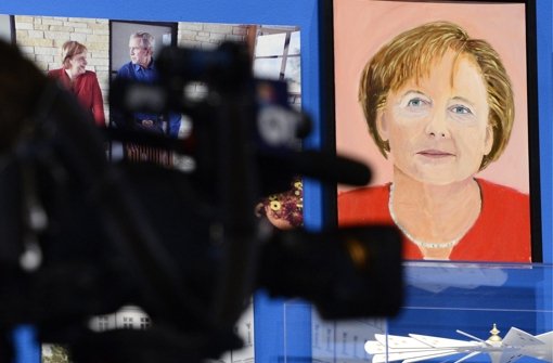 Doch, Ähnlichkeit ist da: George W. Bushs Version von Bundeskanzlerin Angela Merkel. Foto: dpa