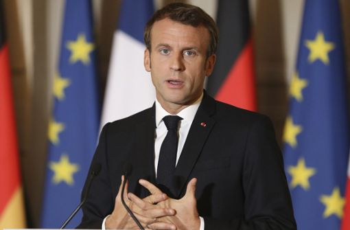Staatspräsident Macron schiebt den Atomausstieg hinaus. Foto: dpa/Ludovic Marin