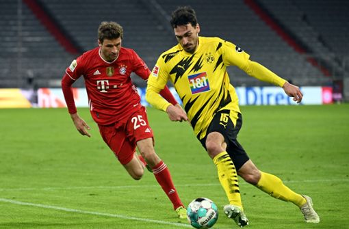 Kann der BVB (re./Mats Hummels) den FC Bayern (Thomas Müller) doch noch ärgern. Foto: dpa/Sven Hoppe
