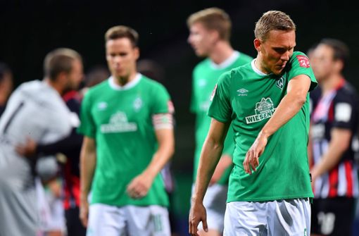 Enttäuschung bei den Spielern von Werder Bremen. Foto: AFP/STUART FRANKLIN