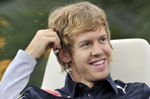 Hat allen Grund zu strahlen: Formel 1-Weltmeister Sebastian Vettel bekommt einen rauschenden Empfang in seinem Heimatort. Foto: AP