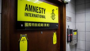 Schwer gesichert: Der Eingang zum Büro von Amnesty International in Hongkong. Foto: AFP/ISAAC LAWRENCE