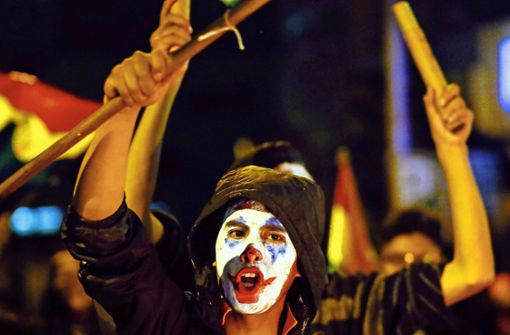 Wut hinter der Maske des Clowns: Demonstranten in der Hauptstadt La Paz. Foto: dpa/Gaton Brito Foto:  