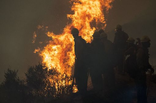 In Kalifornien werden durch die verheerenden Waldbrände noch immer zahlreiche Menschen vermisst. Foto: dpa/Nic Coury