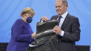 Angela Merkel und Olaf Scholz nehmen an der Runde teil. Foto: dpa/Michael Kappeler