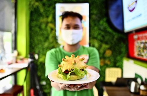 Es muss ja nicht gleich ein Corona-Burger sein. Foto: afp/Manan Vatsyayana
