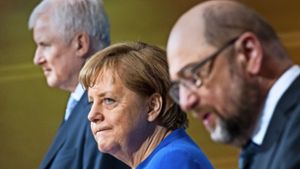 Horst Seehofer, Angela Merkel und Martin Schulz während der Präsentation ihrer Einigung  am Freitag Foto: dpa