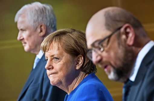 Horst Seehofer, Angela Merkel und Martin Schulz während der Präsentation ihrer Einigung  am Freitag Foto: dpa