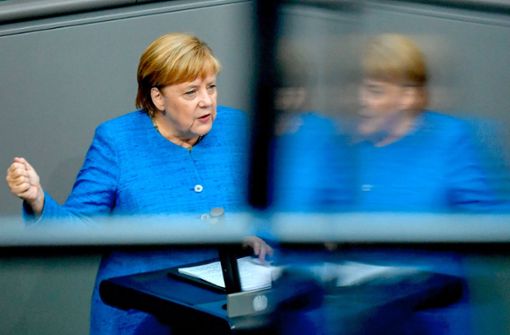 Angela Merkel hat am Mittwoch im Bundestag für die weitreichende Entscheidungen zum Klimaschutz geworben, die ihr Kabinett nächste Woche treffen will. Foto: AFP/John MacDougall