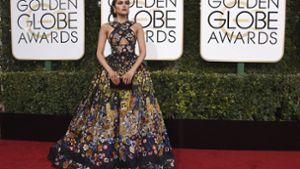 Die amerikanische Schönheitskönigin Olivia Culpo präsentiert sich auf dem Roten Teppich bei der Verleihung der Golden Globes in Los Angeles. Ihre Robe war einer der Hingucker des Abends – konnte man sich doch in ihrem Anblick wie in einem Kunstgemälde verlieren. Foto: AP