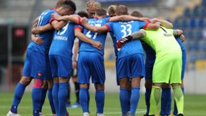 Gemeinsam sind sie stark: Das Außenseiter-Team des 1. FC Heidenheim. Foto: dpa/Friso Gentsch