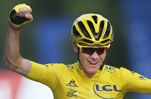 Chris Froome feiert seinen Sieg bei der Tour de France. Foto: AP