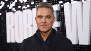 Robbie Williams feiert seinen 50. Geburtstag. Foto: Vianney Le Caer/AP/dpa