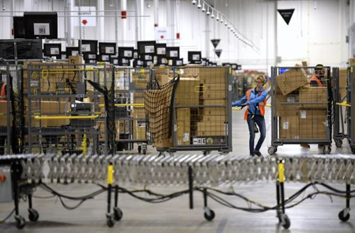 Amazon-Mitarbeiter haben derzeit eine Menge zu tun. Foto: AP/Todd McInturf