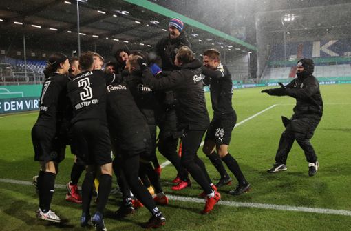 Pokal-Sensation geschafft: Holstein Kiel blamiert den großen FC Bayern München. Foto: dpa/Christian Charisius