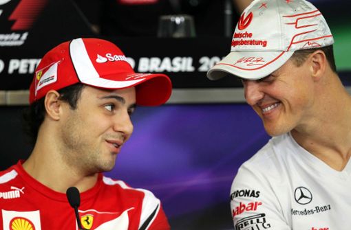 Michael Schumacher (rechts) und Felipe Massa fuhren 2005 und 2006 gemeinsam bei Ferrari. Foto: EFE